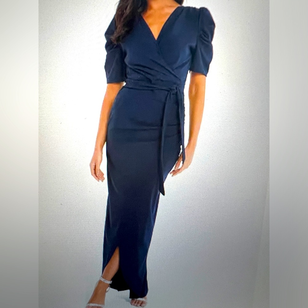 Embrace elegance in this puff sleeved maxi dress. Worn once for 4 hours.